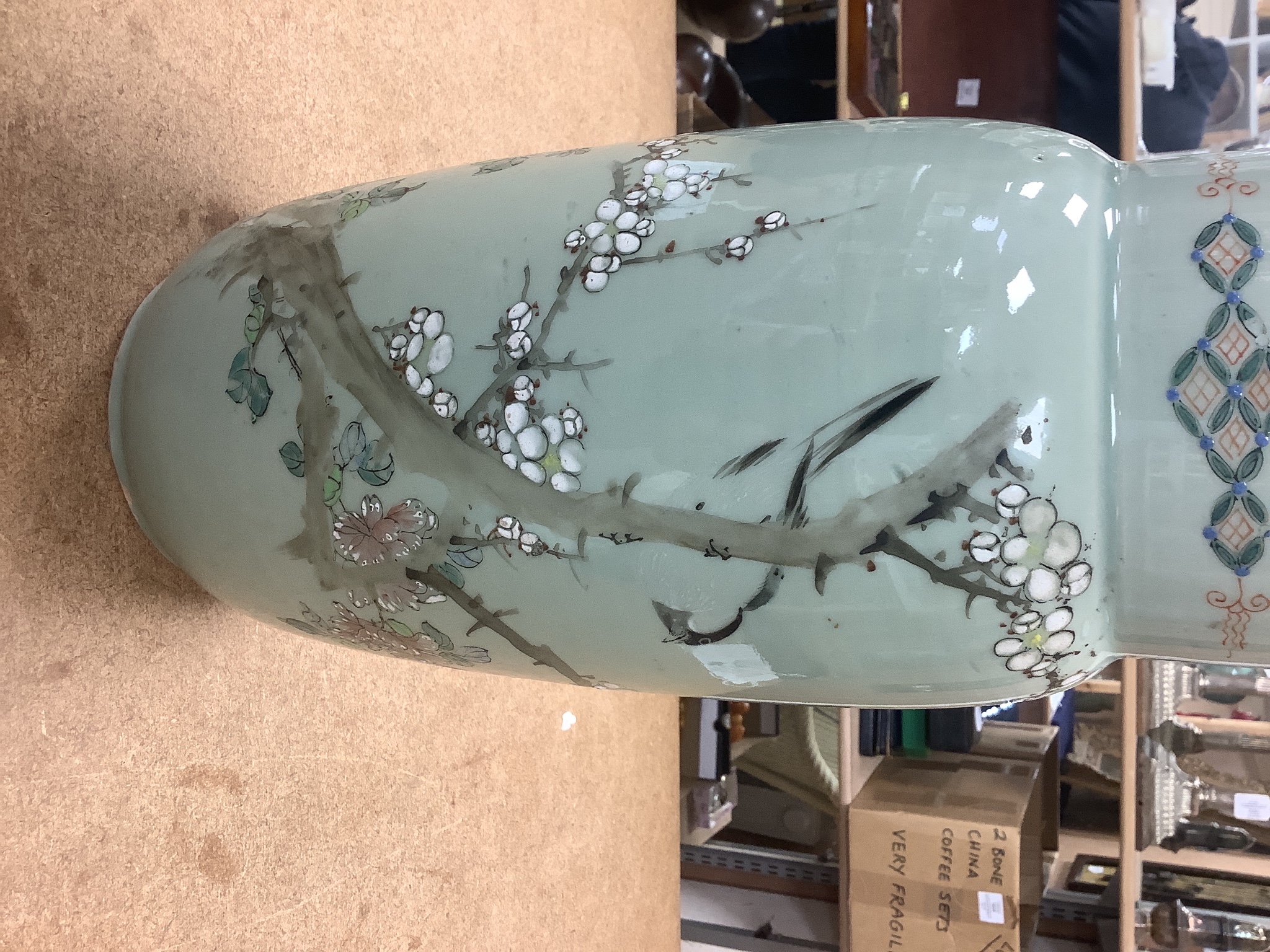 A pair of 19th century Japanese celadon glazed vases (drilled) with hardwood stands, total height 31cm